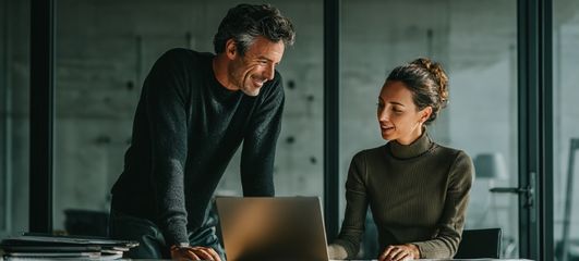 Business owner working with an adviser to secure commercial finance and review funding options